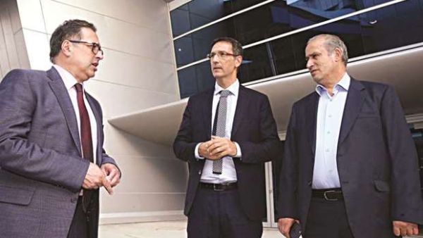 Aspire Academy director general Ivan Bravo (centre) with Football Federation Islamic Republic of Iran president Mehdi Taj. (Photo: Gulf Times)