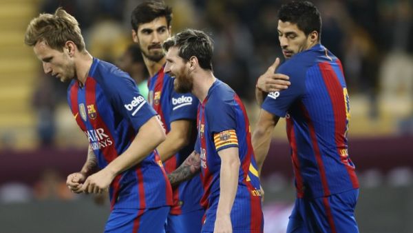 Barcelona's Luis Suarez (R), Linonal Messi (C), Ivan Rakitic (L) and André Gomes (2nd L) celebrate after a goal during a friendly football match between FC Barcelona and Saudi Arabia's Al-Ahli FC on Dec 13, 2016 in the Qatari capital Doha. Barcelona played Al-Ahli in a friendly in Doha, the Spanish club's last major obligation of its four year shirt sponsorship deal with Qatar Airways.