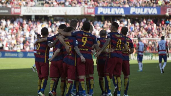 Barcelona's players celebrate their 24th La Liga title at the end of the Spanish league football match Granada CF vs FC Barcelona at Nuevo Los Carmenes stadium in Granada on May 14, 2016. Barcelona sealed their 24th La Liga title as Luis Suarez took his tally for the season to 59 goals with a hat-trick in a 3-0 win at Granada to hold off Real Madrid's late-season surge.
JORGE GUERRERO / AFP