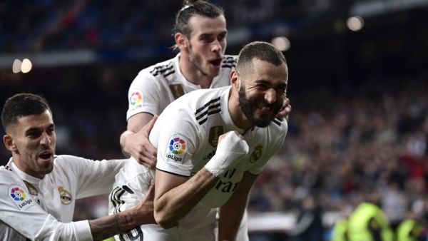 Xabier Etxeita seemed to have earned Huesca a shock draw at Real Madrid, but Karim Benzema fired home to settle a five-goal thriller.