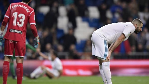 Real Madrid's French forward Karim Benzema bends at the end of the Spanish 'Copa del Rey' (King's cup) quarter-final second leg football match between Real Madrid CF and CD Leganes at the Santiago Bernabeu stadium in Madrid on January 24, 2018.
JAVIER SORIANO / AFP