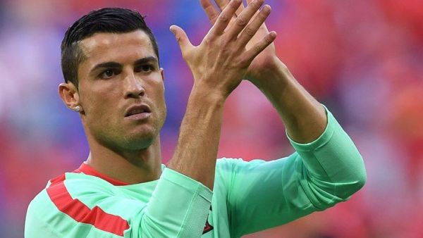 Superstar claims awards after stellar year, as Portugal coach Santos is also singled out