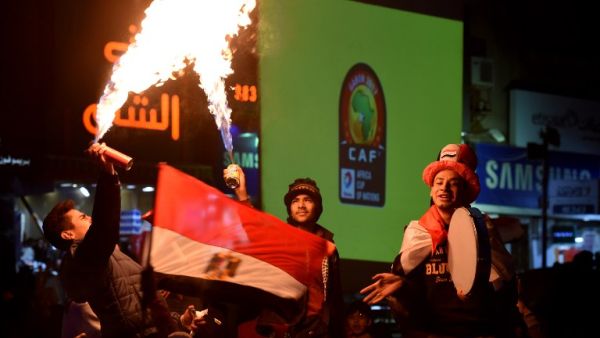 Egyptian fans celebrate after the 2017 Africa Cup of Nations semi-final football match between Burkina Faso and Egypt, in Cairo on February 1, 2017.

MOHAMED EL-SHAHED / AFP