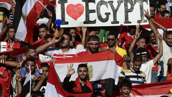 Egyptian fans cheer for their national team before the FIFA World Cup 2018 qualification football match between against Uganda at the Borg al-Arab Stadium near Alexandria on September 5, 2017.
KHALED DESOUKI / AFP