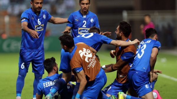 Iranian club Esteghlal's players celebrate after scoring a goal against Saudi club Al-Hilal during their Asian Champions League football match on February 20, 2018 at al-Seeb stadium in Muscat.
MOHAMMED MAHJOUB / AFP