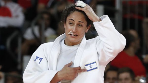 Israel's Yarden Gerbi celebrates after defeating Japan's Miku Tashiro during their women's -63kg judo contest bronze medal A match of the Rio 2016 Olympic Games in Rio de Janeiro on August 9, 2016.
Jack GUEZ / AFP