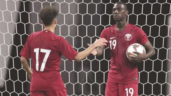 Qatar’s Almoez Ali (right) celebrates with a teammate after scoring against Jordan in a friendly match ahead of next month’s Asian Cup in the UAE. (Photo: Gulf Times)