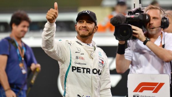 Mercedes' British driver Lewis Hamilton celebrates after taking the pole position in the qualifying session at the Yas Marina circuit on November 24, 2018, in Abu Dhabi, ahead of the Abu Dhabi Formula One Grand Prix.
Andrej ISAKOVIC / AFP