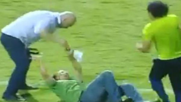 A still from the post-match video as Hossam Hassan (L) assaulted the policeman following an Egyptian Premier League game 