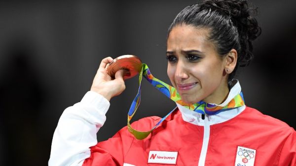 Tunisia's bronze medallist Ines Boubakri cries on the podium during the medal ceremony for the women's individual foil fencing event of the Rio 2016 Olympic Games at the Carioca Arena 3 in Rio de Janeiro on August 10, 2016.
Kirill KUDRYAVTSEV / AFP