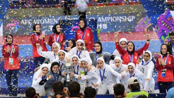 Members of the Iran women's national futsal team celebrate after winning the 2018 AFC Women's Futsal Championship at Indoor Stadium Huamark, Bangkok, Thailand, on May 12, 2018. (Photo: Press TV)