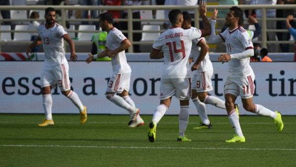 Iran's players celebrate their opening goal during the 2019 AFC Asian Cup group D football match between Vietnam and Iran at the al-Nahyan Stadium in Abu Dhabi on January 12, 2019.
Khaled DESOUKI / AFP