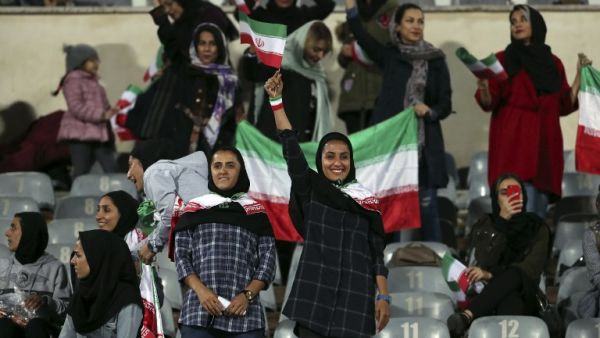 Iranian women cheer during the friendly football match between Iran and Bolivia at the Azadi Stadium in Tehran on October 16, 2018.
STR / AFP