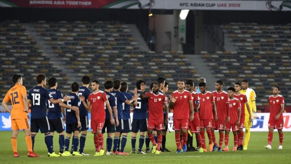 Players shake hands after the 2019 AFC Asian Cup group F football match between Oman and Japan at Hazza bin Zayed Stadium in Abu Dhabi on January 13, 2019.
Khaled DESOUKI / AFP