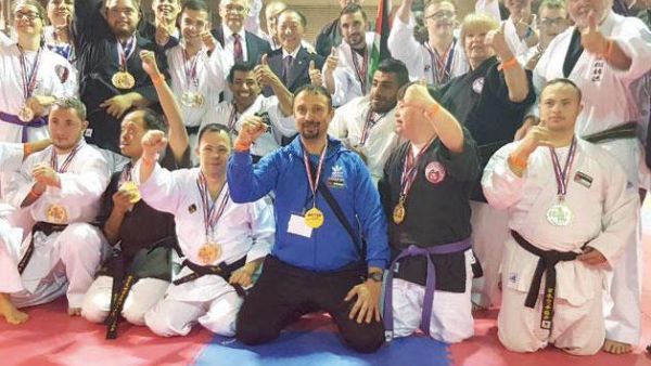 Jordanian karate coach Hussam Ayyad (centre) joins winners of an international competition in a group photo held in the US recently (Photo courtesy of Hussam Ayyad)