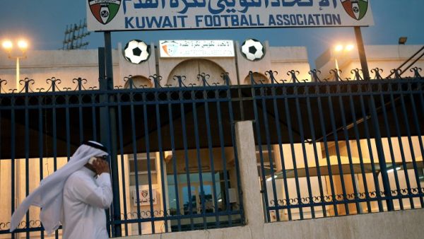 A man walks past the Kuwaiti Football Association (KFA)'s headquarters on October 17, 2015, in Kuwait City. The KFA was suspended by FIFA on October 16, 2015, for government interference, a decision which could impact the team's hopes of qualifying for the 2018 World Cup. AFP PHOTO / YASSER AL-ZAYYAT
YASSER AL-ZAYYAT / AFP