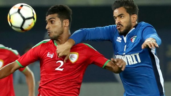 Kuwait's Faisal Ajab (R) vies for the ball with Oman's Mohammad Bin Saleh during the 2017 Gulf Cup of Nations football match between Kuwait and Oman at the Sheikh Jaber al-Ahmad Stadium in Kuwait City on December 25, 2017.

Yasser Al-Zayyat / AFP