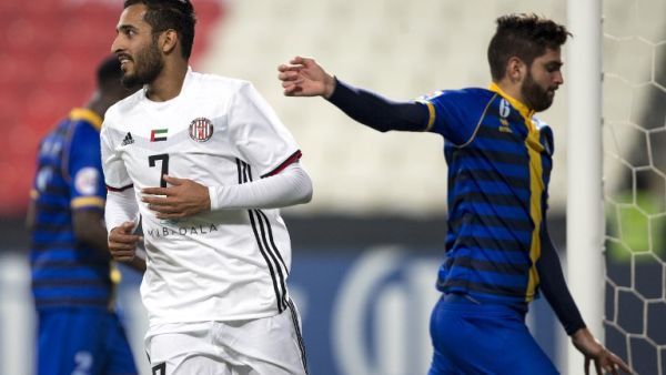 UAE's Al-Jazira's Ali Ahmed Mabkhout (L) celebrates after scoring against Qatar's al-Gharafa's Rubert Fasciana (R) during the AFC Champions League Round 1 Group (A) Match between al-Jazira vs al-Gharafa at the Mohammed Bin Zayed Stadium in abu Dhabi on February 12, 2018.
NEZAR BALOUT / AFP