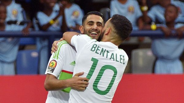 Algeria's forward Riyad Mahrez (back) celebrates with Algeria's midfielder Nabil Bentaleb after scoring a goal during the 2017 Africa Cup of Nations group B football match between Algeria and Zimbabwe in Franceville on January 15, 2017.
KHALED DESOUKI / AFP