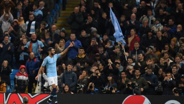 Manchester City's Algerian midfielder Riyad Mahrez celebrates after scoring their fifth goal during a UEFA Champions League group F football match between Manchester City and Shakhtar Donetsk at the Etihad stadium in Manchester, northwest England on November 7, 2018.
Paul ELLIS / AFP