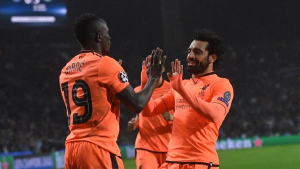 Liverpool's Senegalese midfielder Sadio Mane (L) celebrates with Liverpool's Egyptian midfielder Mohamed Salah after scoring their third goal during the UEFA Champions League round of sixteen first leg football match between FC Porto and Liverpool at the Dragao stadium in Porto, Portugal on February 14, 2018. Liverpool won the game 5-0.
Francisco LEONG / AFP
