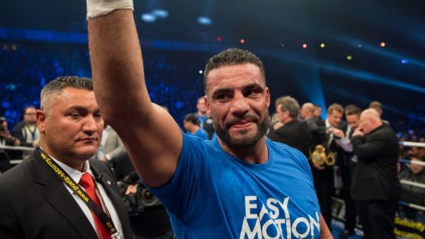 Photo taken on Nov 25, 2017 shows Manuel Charr (C) celebrating after winning the WBA world heavyweight boxing title in a bout against Russia's Alexander Ustinov on November 25, 2017 in Oberhausen, western Germany. Charr on November 29, 2017 ended the confusion about his nationality, admitting that he had no German passport.
Guido Kirchner / dpa / AFP