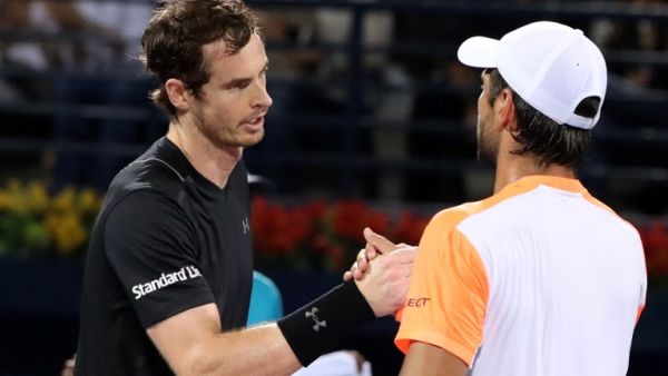 World number one Andy Murray (L) of Great Britain embraces Spain's Fernando Verdasco following their ATP final tennis match which Murray won, concluding the Dubai Duty Free Championships on March 4, 2017.
KARIM SAHIB / AFP