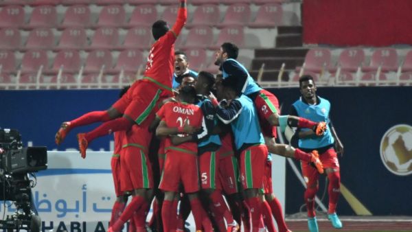 Oman's team celebrate after scoring a goal during the 2017 Gulf Cup of Nations football match between Saudi Arbia and Oman at the Kuwait Stadium in Kuwait City on December 28, 2017.

GIUSEPPE CACACE / AFP