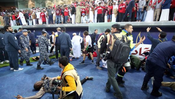 Wounded fans await treatment after a glass barrier broke at the end of the Gulf Cup of Nations 2017 final football match between Oman and the UAE at the Sheikh Jaber al-Ahmad Stadium in Kuwait City on January 5, 2018.
Yasser Al-Zayyat / AFP