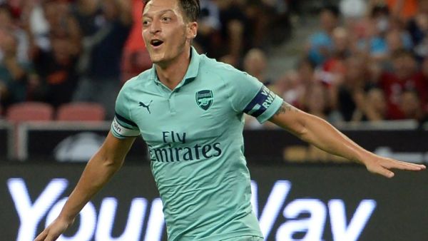 Mesut Ozil of Arsenal celebrates after scoring during the International Champions Cup football match between Arsenal and Paris Saint-Germain in Singapore on July 28, 2018.
ROSLAN RAHMAN / AFP