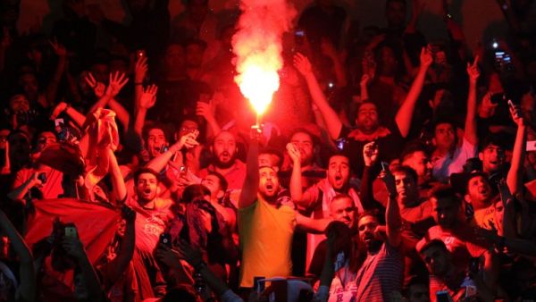 Persepolis fans cheer during the Asian Champions League football match between UAE's Al-Wahda and Iran's Persepolis at the Azadi Stadium in Tehran on May 8, 2017.
ATTA KENARE / AFP