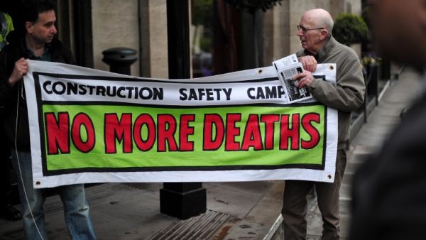 Protesters demonstrate against the perceived exploitation of workers in Qatar, the location of the 2022 World Cup, before a UEFA Congress in central London on May 24, 2013. AFP PHOTO/CARL COURT
CARL COURT / AFP