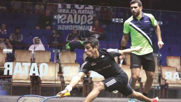 India’s Saurav Ghosal (left) in action against Kuwait’s Ammer al-Tamimi during the qualifying round for the Qatar Classic squash yesterday. (Photo: Jayan Orma)