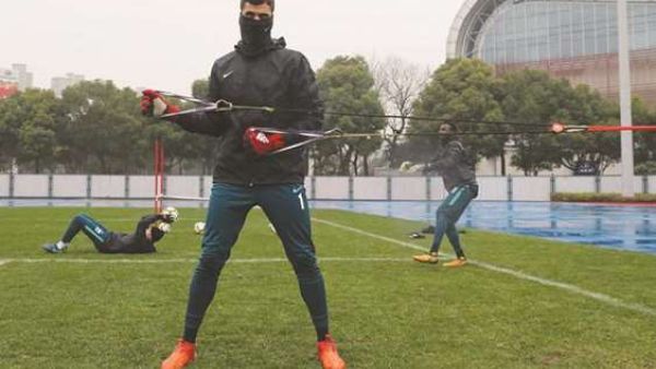 Qatari players warm up for Vietnam in cold Changzhou (Photo: Gulf Times)