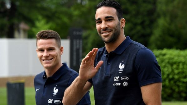 France's forward Kevin Gameiro (L) and defender Adil Rami walk at the French national football team training base in Clairefontaine on May 24, 2016, as part of the team's preparation for the upcoming Euro 2016 European football championships.
FRANCK FIFE / AFP