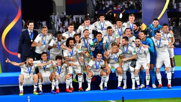 Real Madrid's players celebrate with the trophy after winning the FIFA Club World Cup final football match Spain's Real Madrid vs Abu Dhabi's Al Ain at the Zayed Sports City Stadium in Abu Dhabi, the capital of the United Arab Emirates, on December 22, 2018.
Giuseppe CACACE / AFP