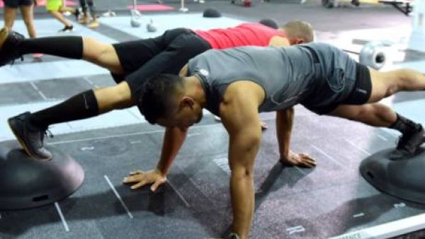 One-legged pushups on top of Bosu balls on the moving REAX Board demands great coordination and balance (Photo: Gulf News)