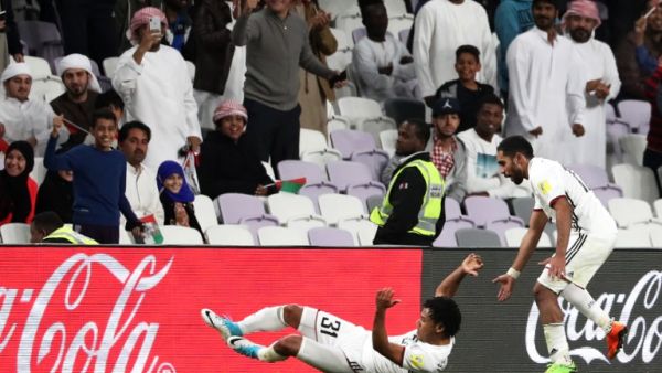 UAE's al-Jazira club player Romarinho (L) celebrates with his teammates and fans after scoring a goal during their FIFA Club World Cup UAE 2017 first round football match between al-Jazira and Auckland City FC at the Hazza Bin Zayed Stadium on December 6, 2017 in Al-Ain.
KARIM SAHIB / AFP