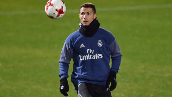Real Madrid's Portuguese forward Christiano Ronaldo warms up during a training session at Mitsuzawa stadium in Yokohama on December 13, 2016 ahead of their Club World Cup football match against Club America of Mexico on December 15.
KAZUHIRO NOGI / AFP