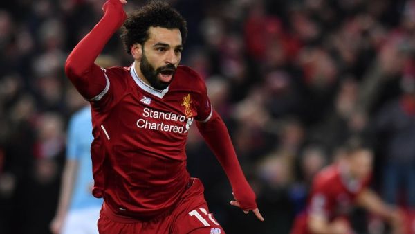 Liverpool's Egyptian midfielder Mohamed Salah celebrates scoring the opening goal during the UEFA Champions League first leg quarter-final football match between Liverpool and Manchester City, at Anfield stadium in Liverpool, north west England on April 4, 2018.
Anthony Devlin / AFP