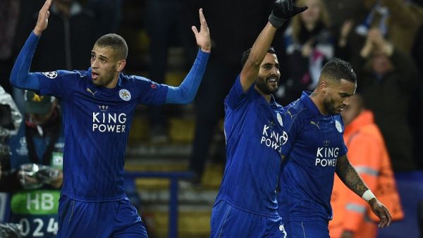 Leicester City's Algerian striker Islam Slimani (L) reacts after Leicester City's Algerian midfielder Riyad Mahrez (C) scored his team's first goal during the UEFA Champions League group G football match between Leicester City and FC Copenhagen at the King Power Stadium in Leicester, central England on October 18, 2016.
OLI SCARFF / AFP