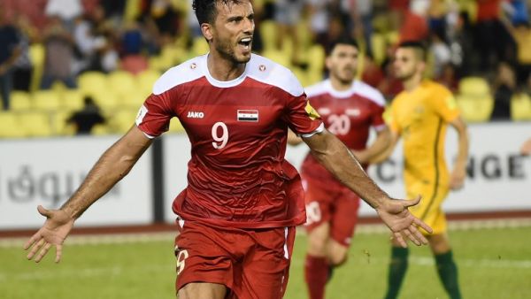 Omar Al Soma of Syria (L) celebrates a penalty goal against Australia during the 2018 World Cup qualifying football match between Syria and Australia at the Hang Jebat Stadium in Malacca on October 5, 2017.
MOHD RASFAN / AFP