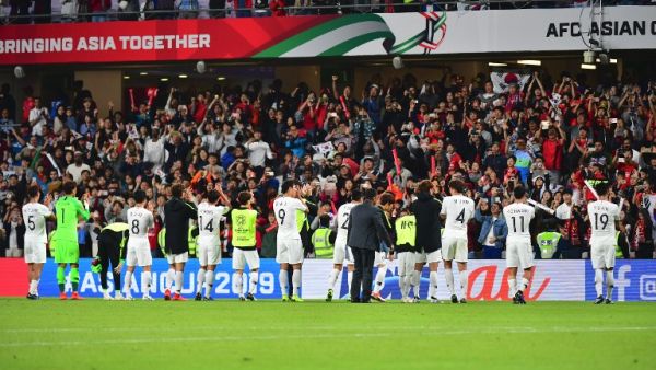 South Korea's players celebrate after winning the 2019 AFC Asian Cup group C football match between Kyrgyzstan and Korea Republic at Hazza bin Zayed Stadium in Abu Dhabi on January 11, 2019.
Giuseppe CACACE / AFP South Korea's players celebrate after winning the 2019 AFC Asian Cup group C football match between Kyrgyzstan and Korea Republic at Hazza bin Zayed Stadium in Abu Dhabi on January 11, 2019.
Giuseppe CACACE / AFP