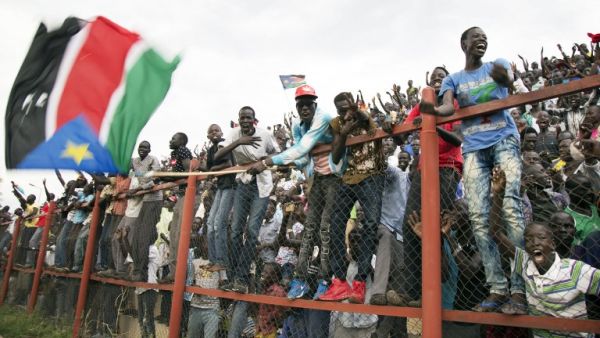 South Sudan's fans cheer after South Sudan scored a second goal during their first round African Nations Championship qualifying football match against Somalia at Juba Football Stadium on April 30, 2017.
Albert Gonzalez Farran / AFP
