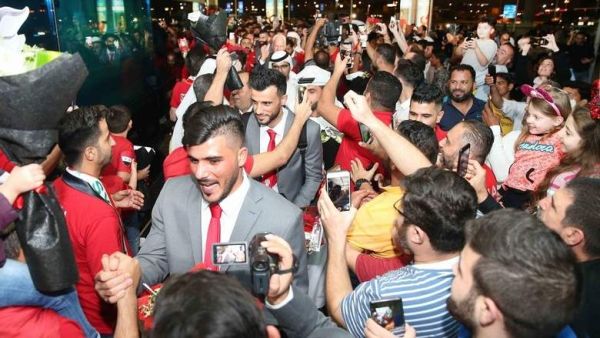 Fans greet Syrian national team on their arrival in Sharjah. (Supplied photo)