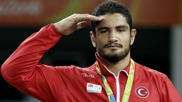 Turkey's gold medallist Taha Akgul stands on the podium at the end of the men's 125kg freestyle wrestling event at the Carioca Arena 2 in Rio de Janeiro on August 20, 2016, during the Rio 2016 Olympic Games.
Jack GUEZ / AFP
