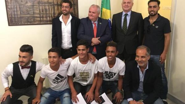 Brazilian Ambassador to Jordan Francisco Carlos Soares Luz pose for a group photo with young Syrian refugees at the embassy on Sunday (Photo: Camille Dupire)