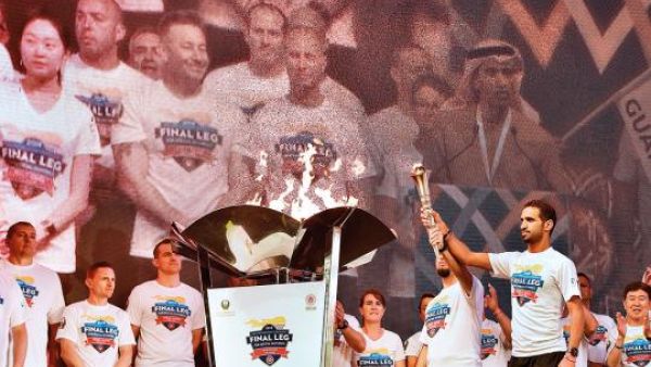 Athletes Daniel and Yassir light and carry the torch at the closing ceremony of the Host Town Program in Dubai preceding the Special Olympics World Games Abu Dhabi 2019 at Global Village on 10th March, 2019. (Photo: Clint Egbert/Gulf News)
