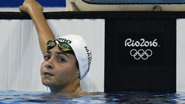 Refugee Olympic Team's Yusra Mardini takes part in the Women's 100m Butterfly heat during the swimming event at the Rio 2016 Olympic Games at the Olympic Aquatics Stadium in Rio de Janeiro on August 6, 2016.
Martin BUREAU / AFP