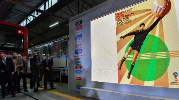 The official poster for the 2018 FIFA World Cup is displayed on a screen during a presentation at Moscow's Krasnaya Presnya metro depot on November 28, 2017.
Mladen ANTONOV / AFP